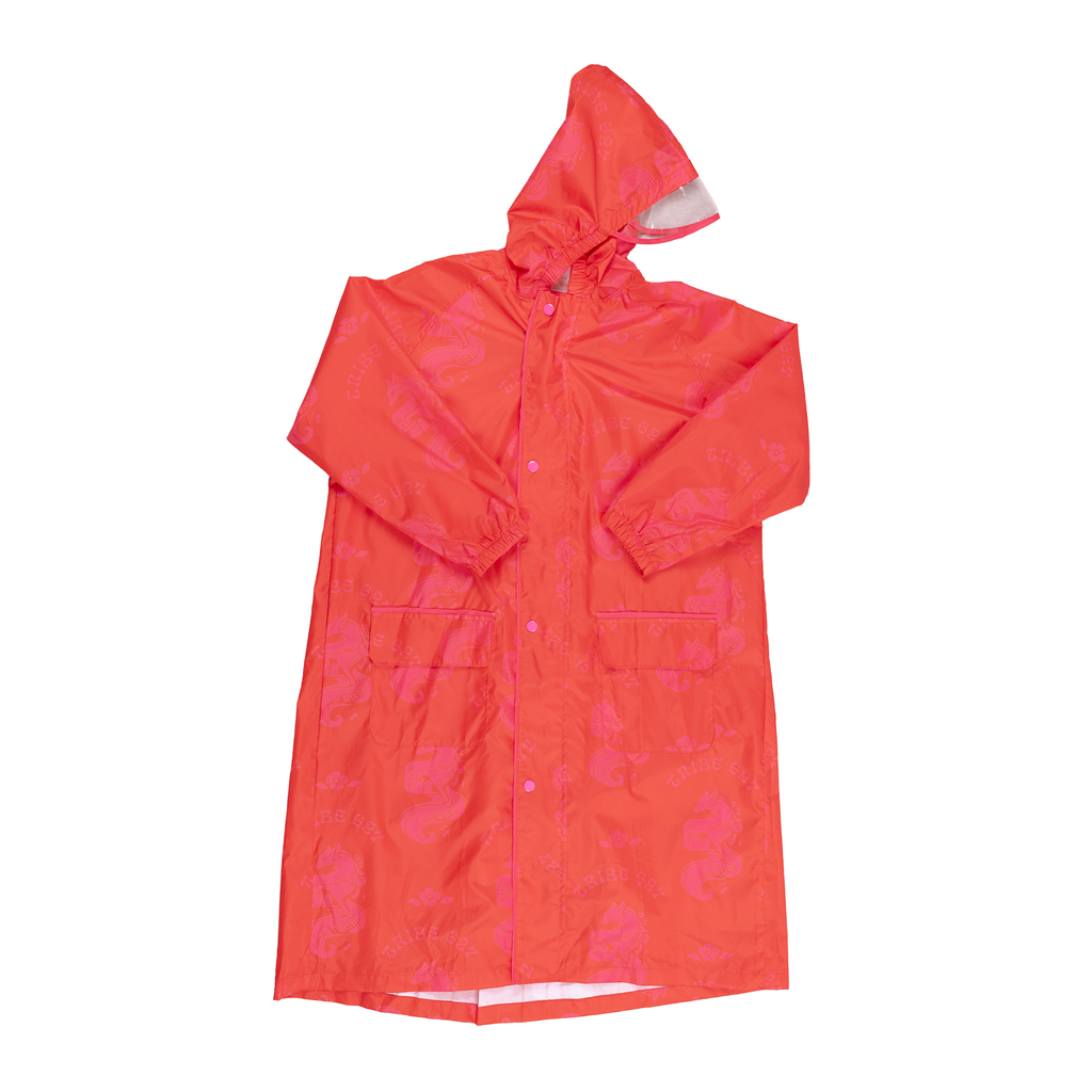 A bright orange-red hooded raincoat with a pink fox pattern, laid flat against a white background.